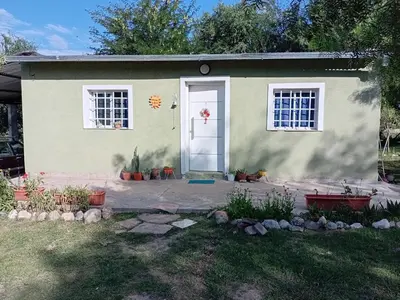 a house with a white door and windows at La grina in Bialet Massé