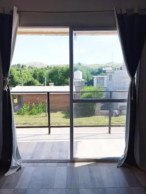 an open door to a balcony with a view at La Cautivadora, Potrero de Garay in Potrero de Garay