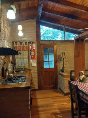a kitchen with a stove top oven in a room at soy ahora in San Javier