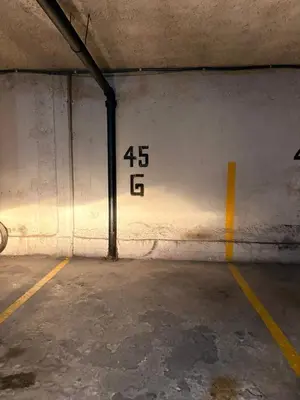 a parking garage with numbers on the wall at Departamento 3 centro villa carlos paz in Villa Carlos Paz