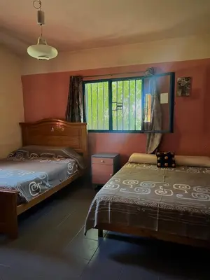 a bedroom with two beds and a window at Mar y Mar in La Estancia