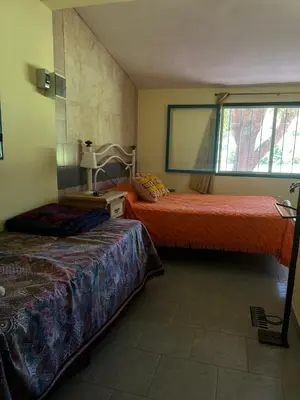 a bedroom with two beds and a window at Mar y Mar in La Estancia