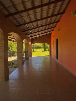 an empty hallway of a building with an arcade at Mar y Mar in La Estancia