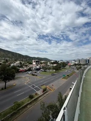 a view of a highway with a city in the background at Departamento Carilo in Villa Carlos Paz