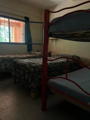 a room with two bunk beds and a window at Mar y Mar Naturaleza y comodidad in La Estancia