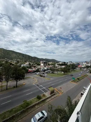 a view of a street with cars on the road at Depto Carillo 4p in Villa Carlos Paz