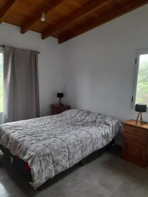 a bedroom with a bed and a window at Casa los nonos in Cordoba