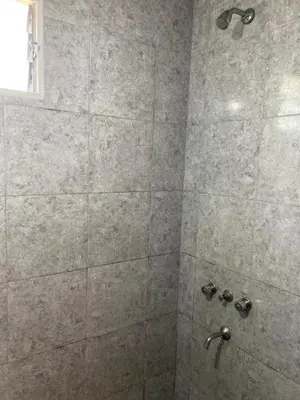 a bathroom with a shower with a glass door at Aires de las Sierras in Villa Carlos Paz