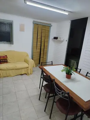 a living room with a table and a couch at La casona Segunda Usina in Embalse