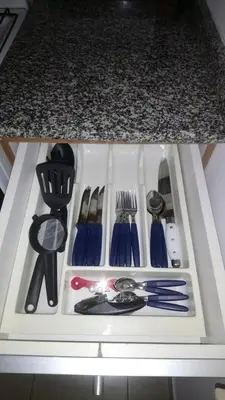 a drawer filled with utensils on top of a counter at Apartamentos Santa Rosa PB 2 in Cordoba