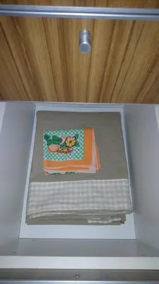a cake in a box in a drawer at Apartamentos Santa Rosa PB 2 in Cordoba