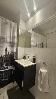 a bathroom with a sink and a mirror at LitStay Laprida 2 in Cordoba