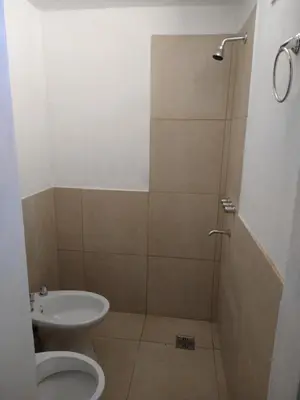 a bathroom with a shower with a toilet and a sink at El diquecito monoambiente in Casa Bamba