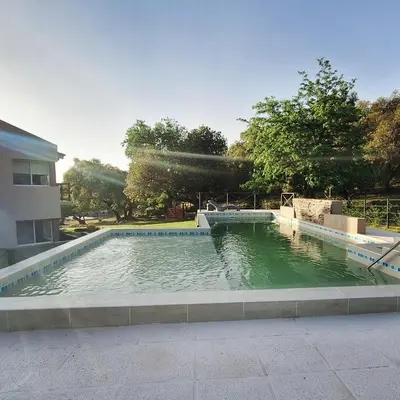 a pool of water in the middle of a building at COSTA COM Apart Suites in Merlo