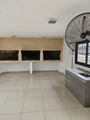 a large room with a kitchen with a fan at Apartamento Esquiu H in Villa Carlos Paz