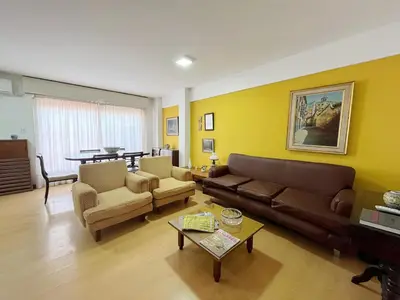 a living room with a couch and chairs and a table at Amplio Piso Vintage, Terraza con Vista a Sierras in Cordoba