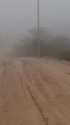 a dirt road in the fog on a dirt road at Alto de Balcon B in Tanti