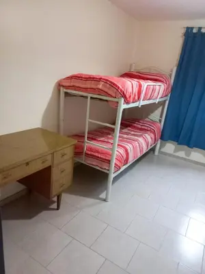 a room with a desk and a bunk bed at Alto de Balcon B in Tanti
