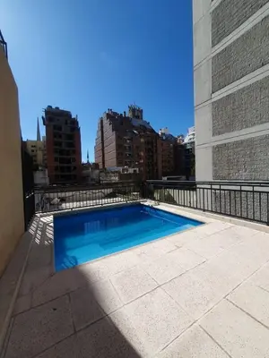 a swimming pool on the roof of a building at LOAN Nueva Cordoba 4E in Cordoba