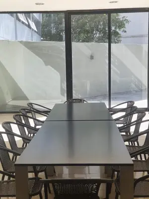 a table and chairs in front of a window at Nueva Cordoba 3D in Cordoba