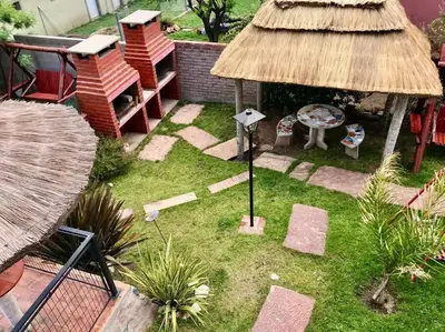 an aerial view of a garden with a thatch roof at LA MILAGROS ZORZAL COLORADO in Merlo