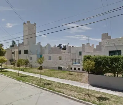 an empty street in front of a large building at Castillo Del Lago - Carlos Paz - dep17 in Villa Carlos Paz